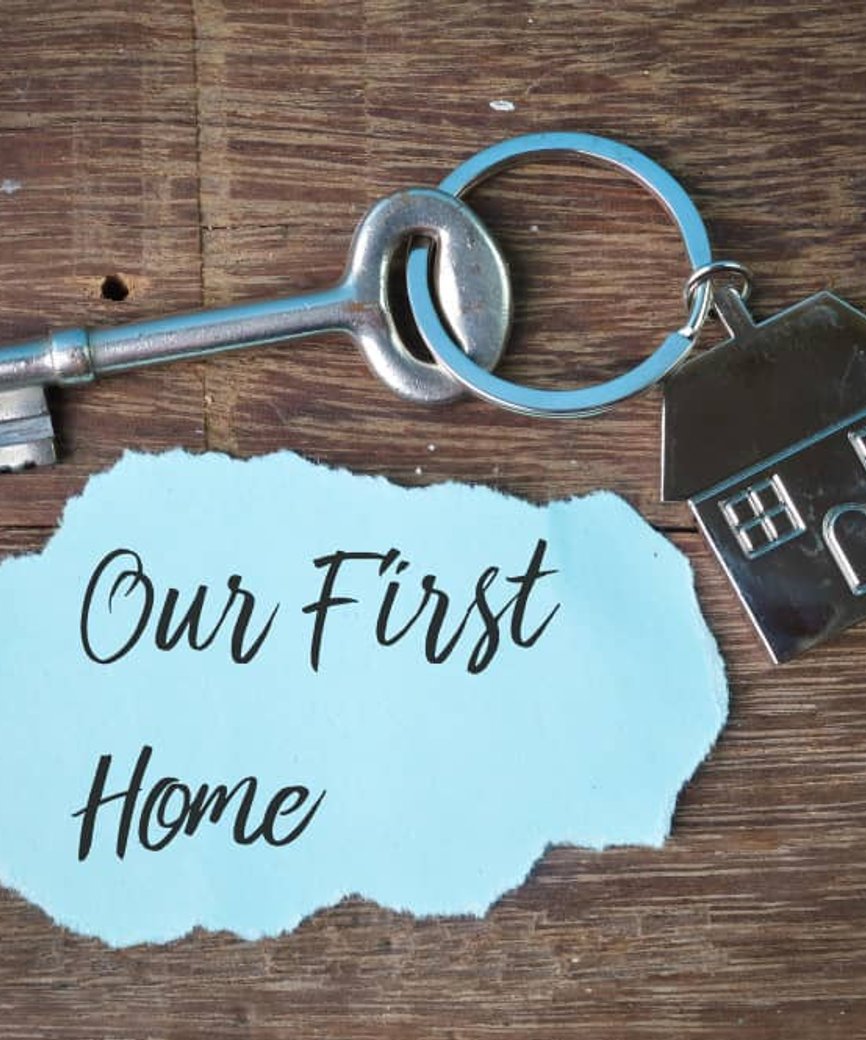 first-time home buyers receiving keys to their new house